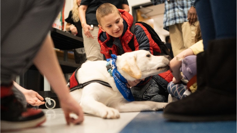 Louie with students