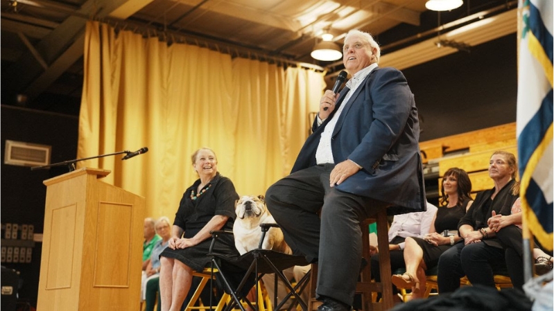 Governor Justice speaking beside Babydog and First Lady Justice at Ruby's Pup Rally