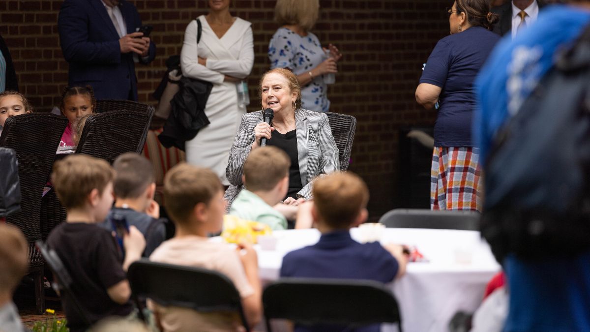 First Lady Justice sitting and speaking to students