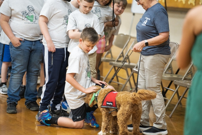 Oakley with Students