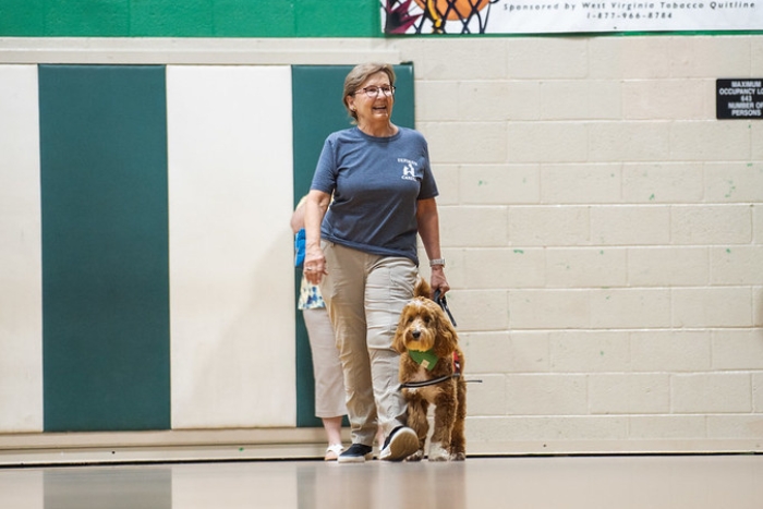 Oakley with trainer at pup rally