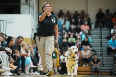 Ruby with trainer at pup rally